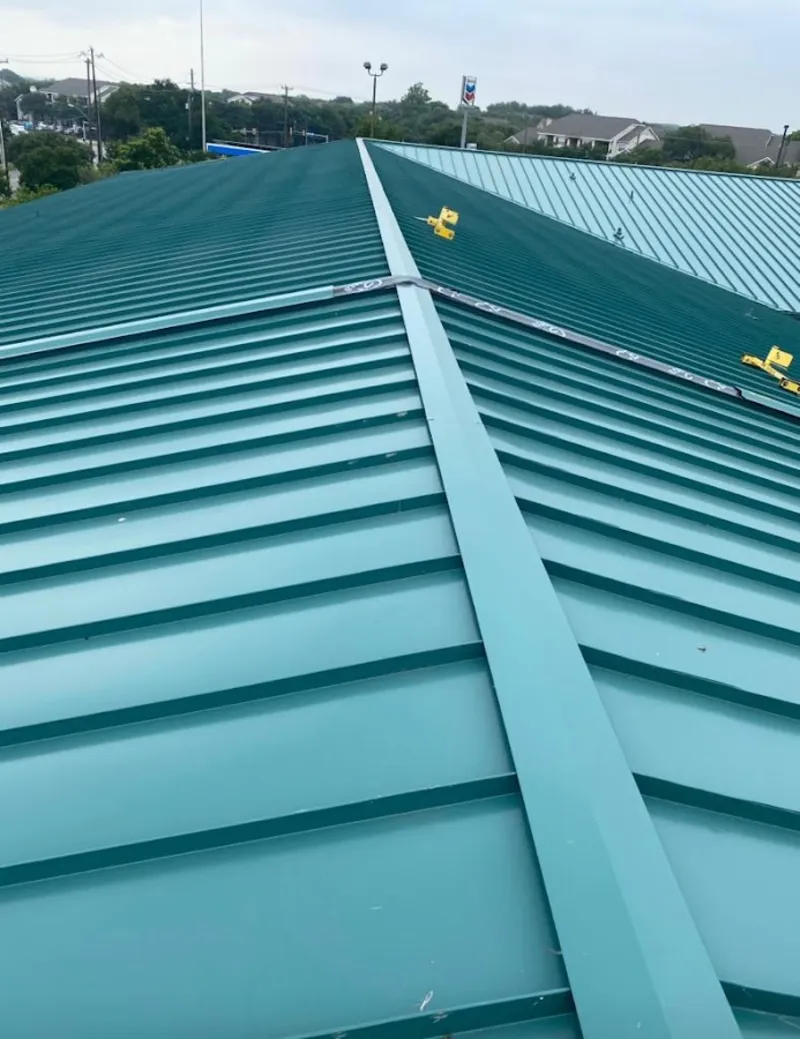 Green commercial metal roof ridge and valley for Metal Roof Repair in Lyon